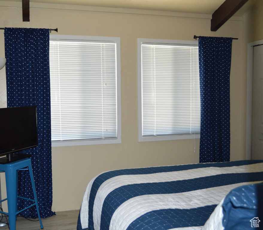 Bedroom with wood finished floors