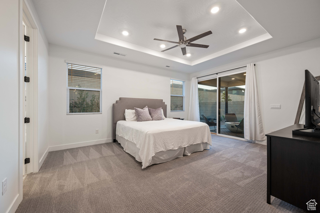 Bedroom featuring carpet floors, recessed lighting, visible vents, and access to exterior