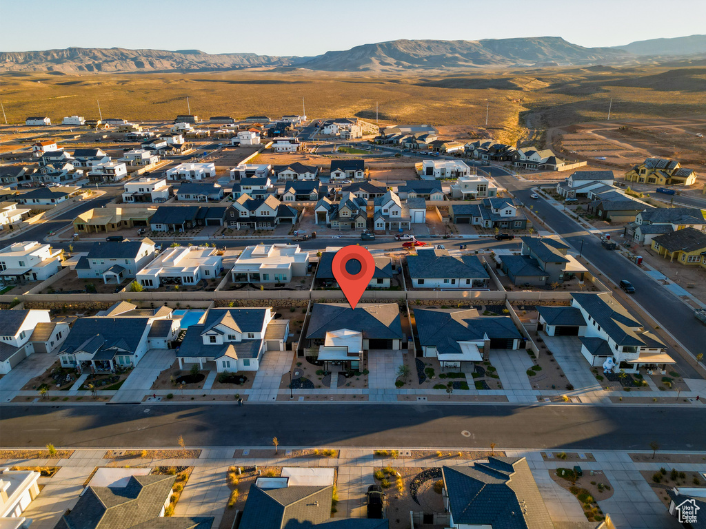 Drone / aerial view with a residential view and a mountain view
