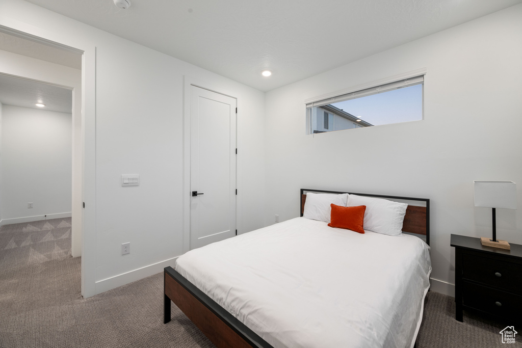 Bedroom featuring carpet floors, baseboards, a closet, and recessed lighting