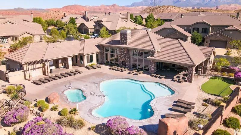 Pool featuring a patio, a mountain view, and a residential view
