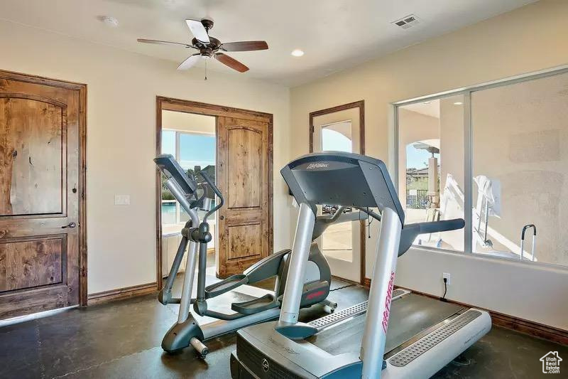Exercise area with recessed lighting, ceiling fan, visible vents, and baseboards