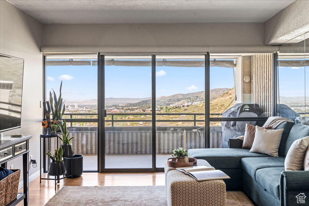 Sunroom featuring a mountain view