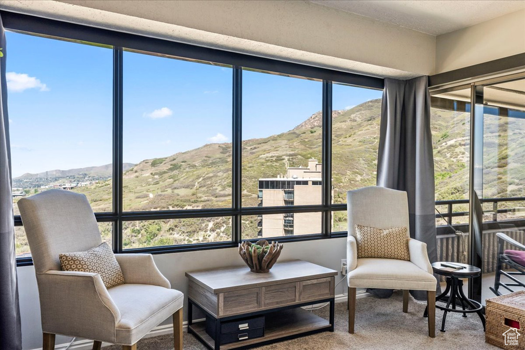 Sunroom with a mountain view