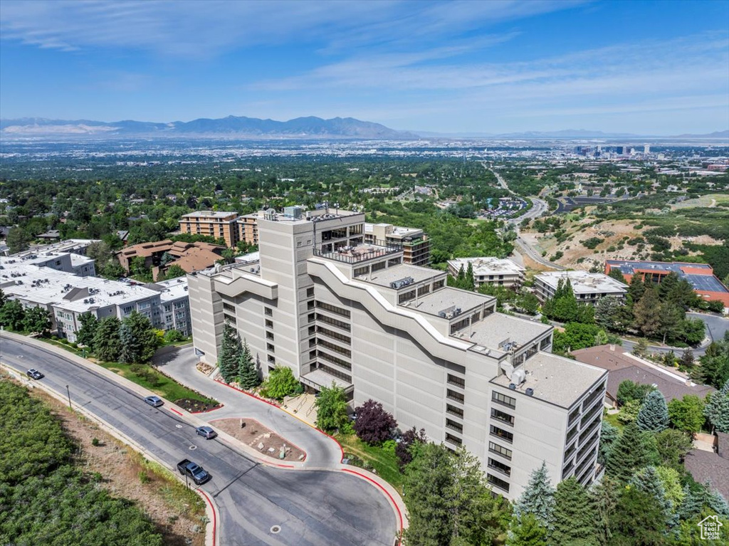 Birds eye view of property with a mountain view