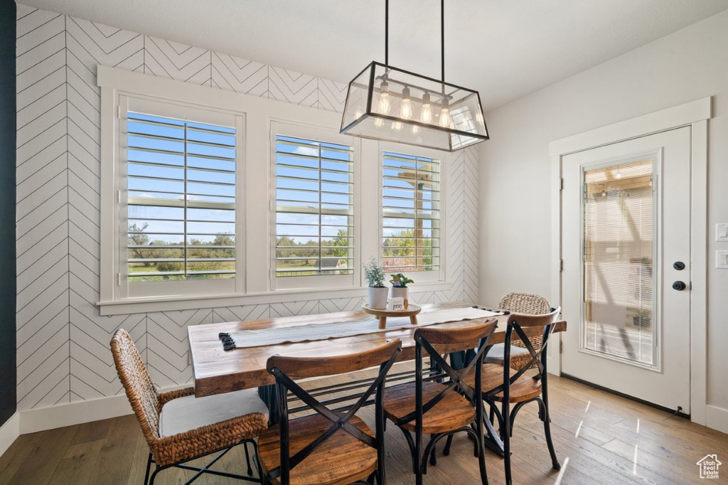 Dining space with light wood-type flooring, baseboards, breakfast area, and a wealth of natural light