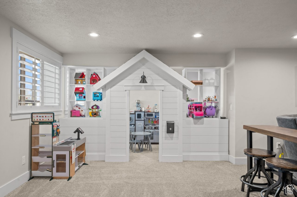 Rec room featuring carpet floors and recessed lighting