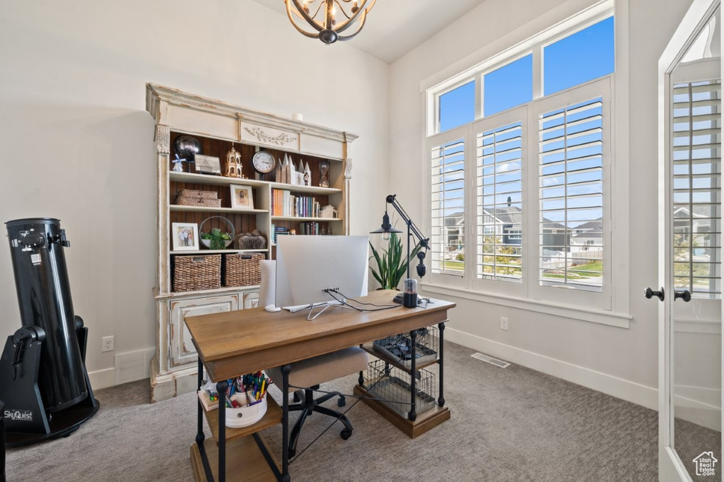 Home office with baseboards, visible vents, and a healthy amount of sunlight