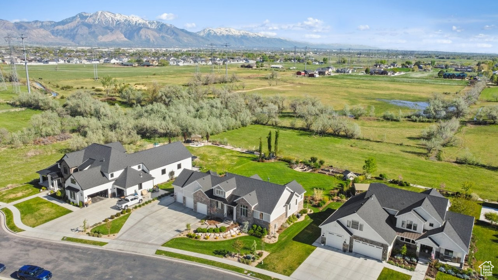 Birds eye view of property with a mountain view