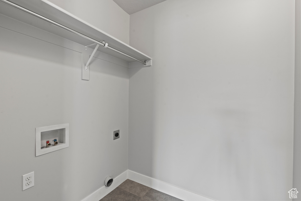 Laundry area with baseboards, laundry area, electric dryer hookup, and hookup for a washing machine