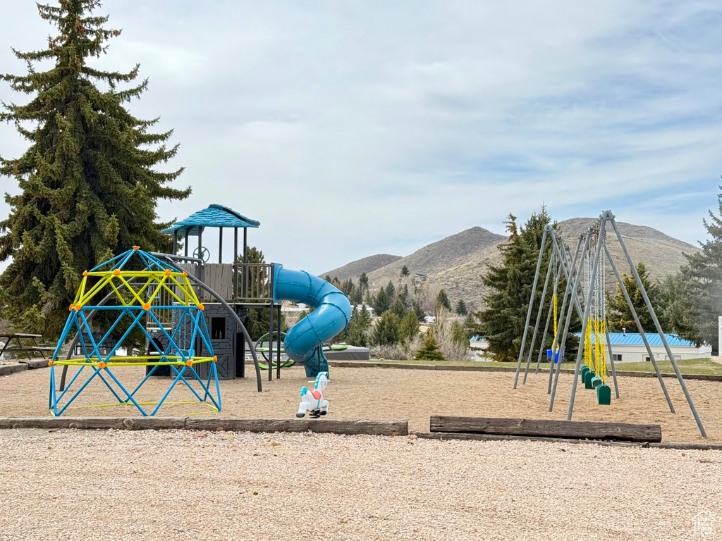 Community jungle gym with a mountain view