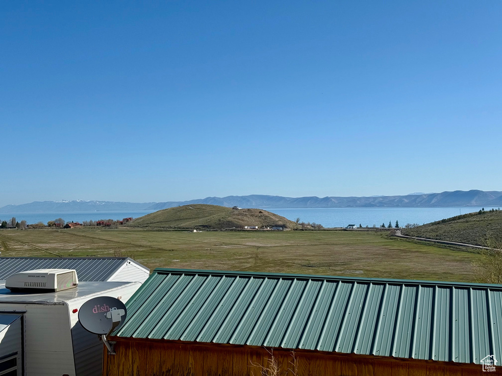 Property view of mountains featuring a water view