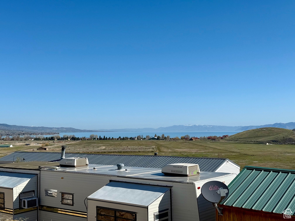 Exterior space featuring a water and mountain view