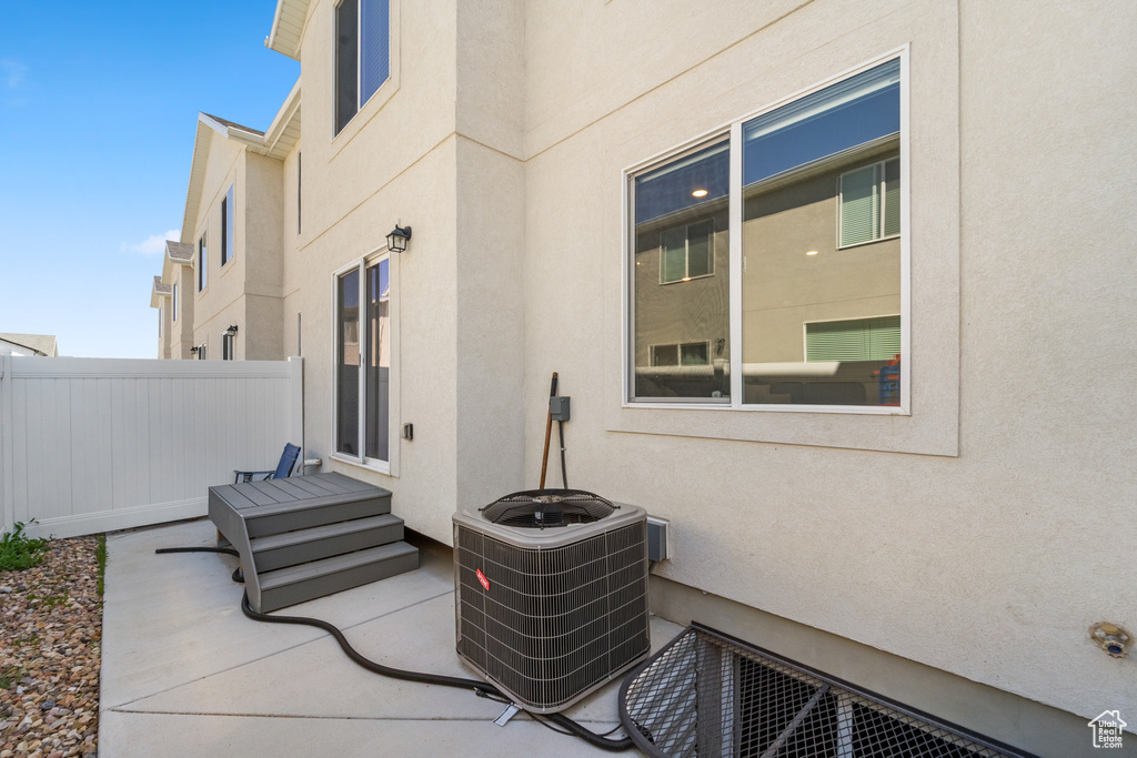 View of patio / terrace with central air condition unit and fence