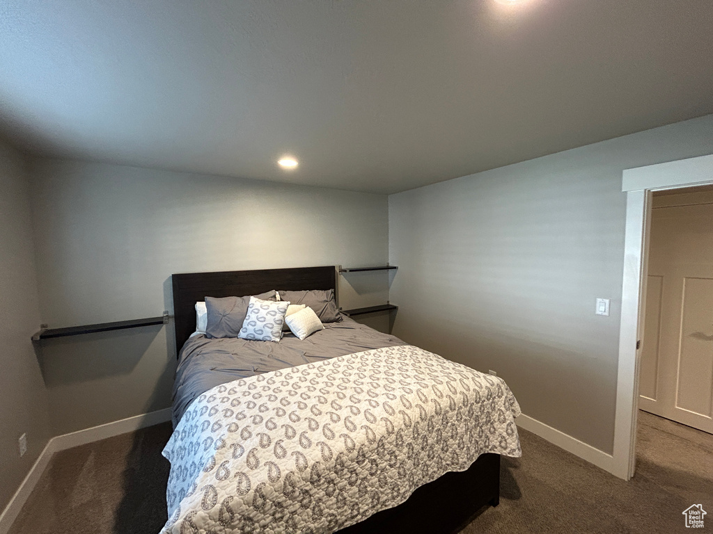 Bedroom featuring baseboards, recessed lighting, and carpet