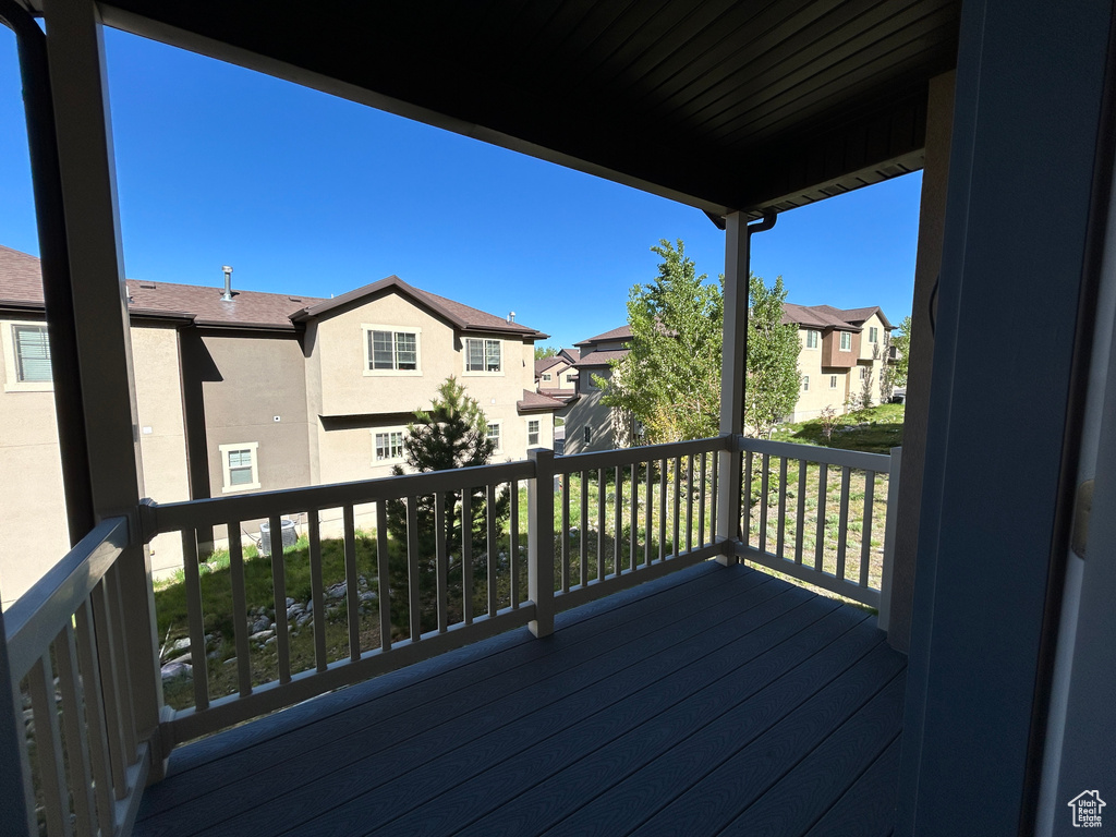 Wooden terrace featuring a residential view
