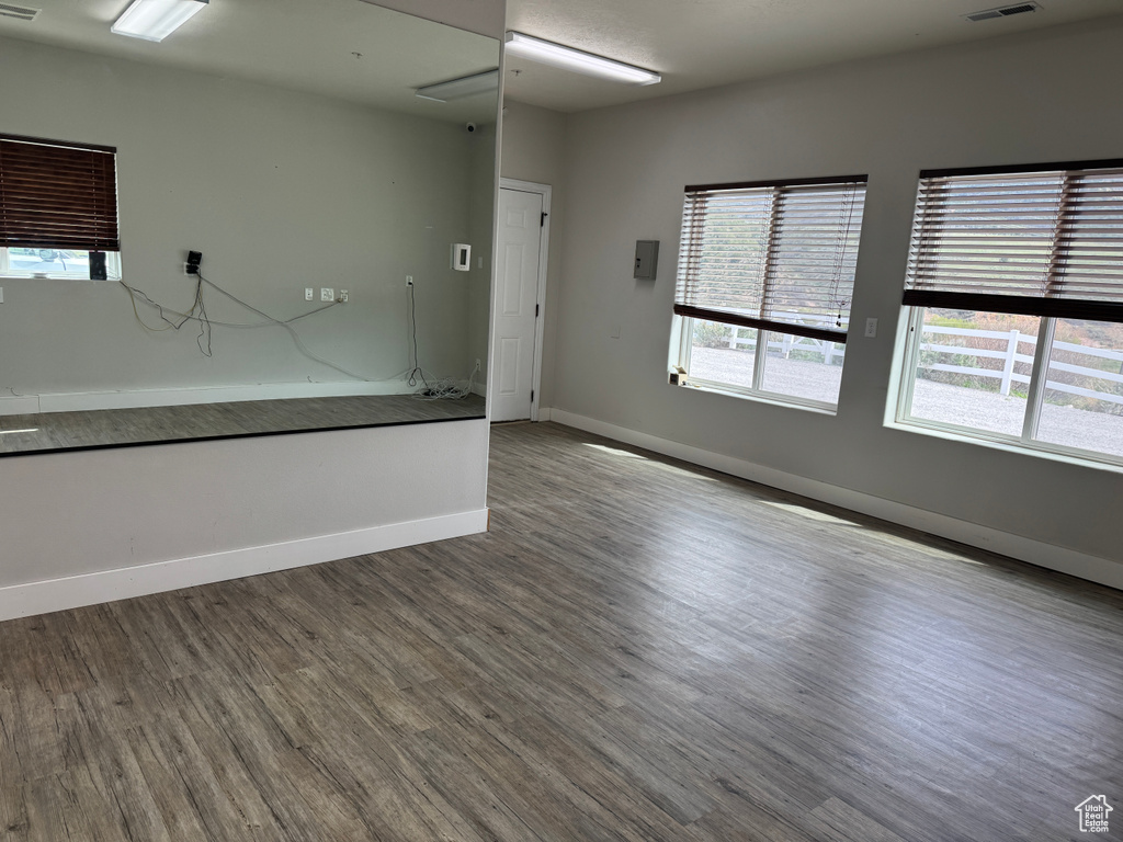 Spare room with wood finished floors and baseboards