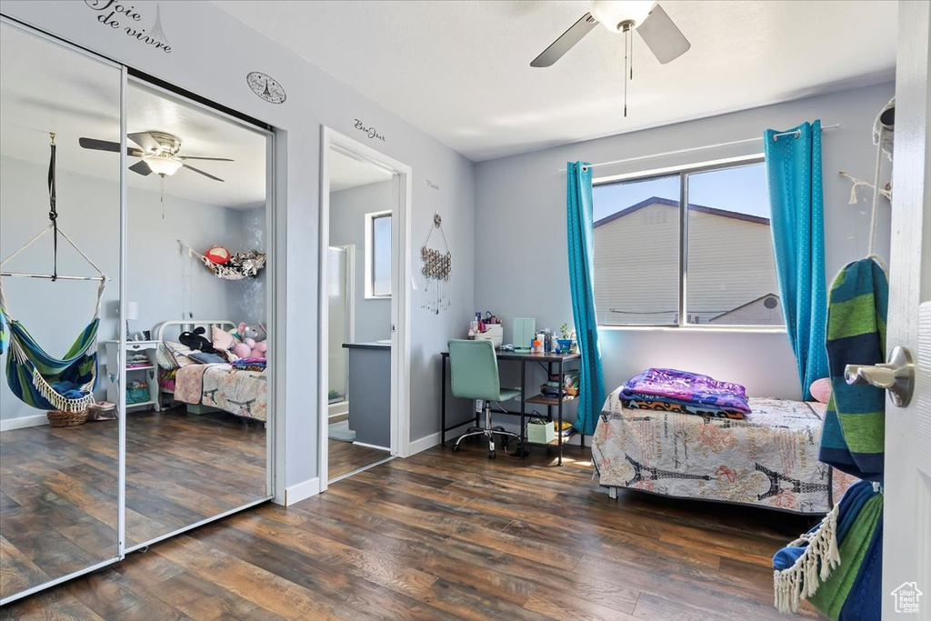 Bedroom with baseboards, a ceiling fan, and wood finished floors