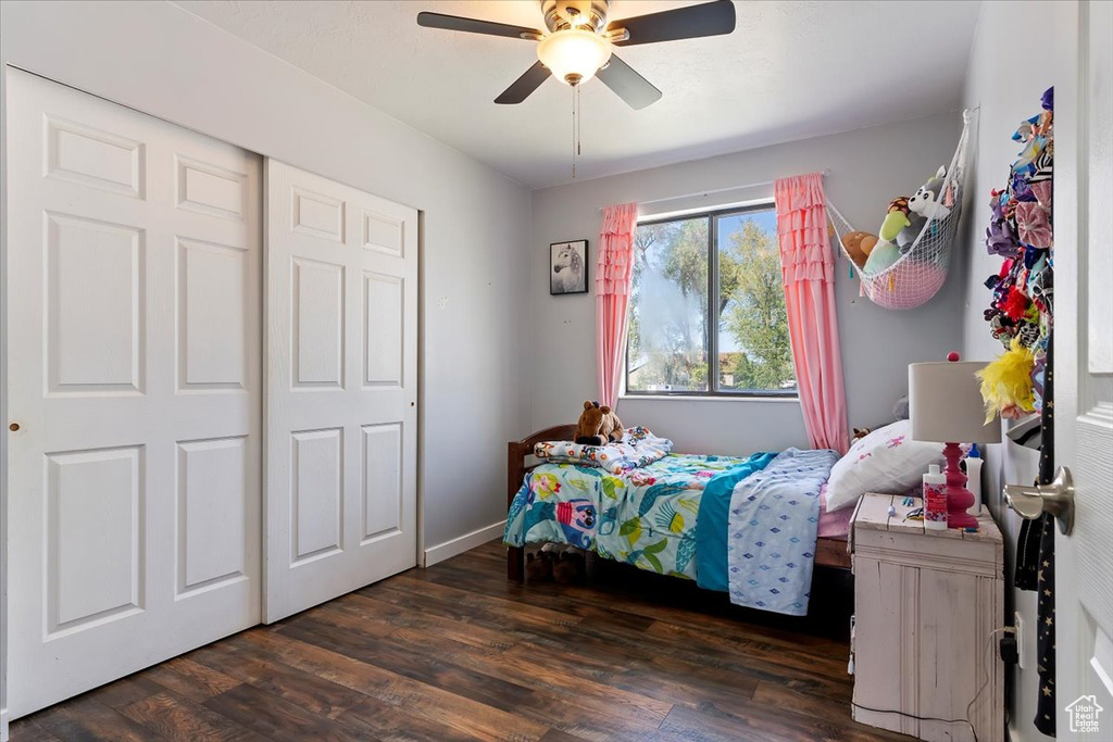 Bedroom with a ceiling fan and wood finished floors