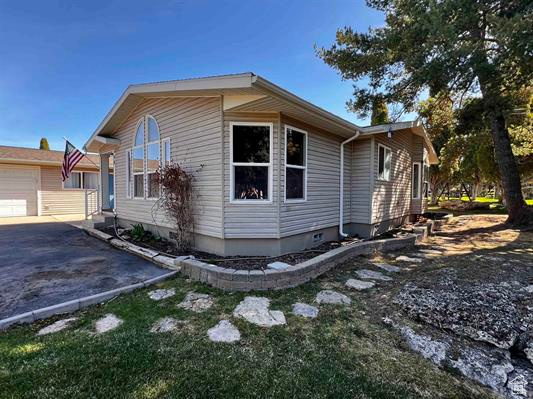 View of property exterior with aphalt driveway