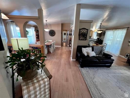 Living area featuring plenty of natural light and wood finished floors