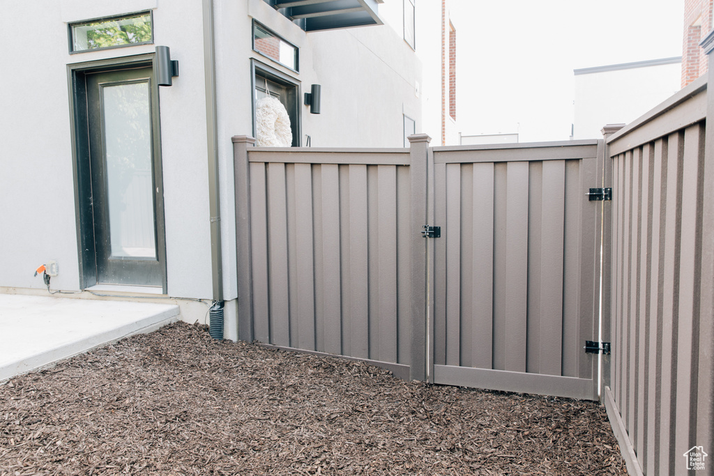 View of gate featuring fence