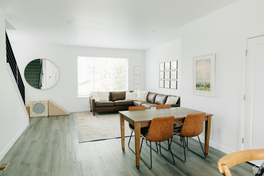 Dining space with baseboards and wood finished floors