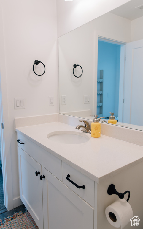 Bathroom with vanity and visible vents