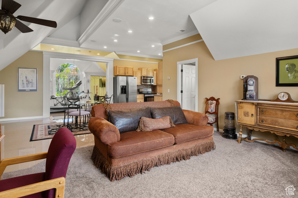 Carpeted living area with recessed lighting, ceiling fan, ornamental molding, and baseboards