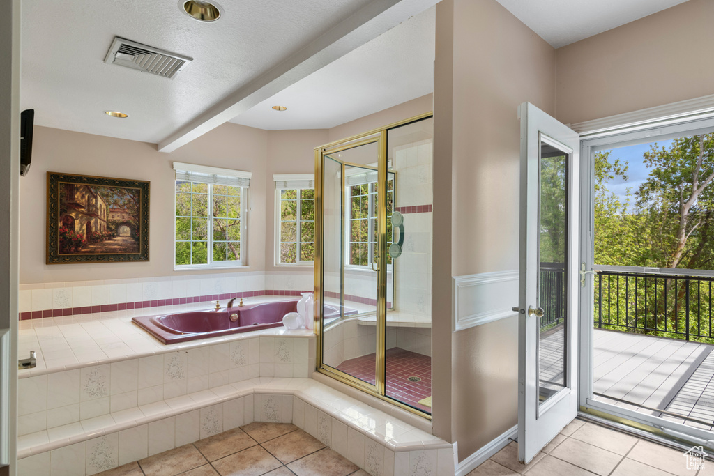 Bathroom with visible vents, a shower stall, tile patterned flooring, and a garden tub