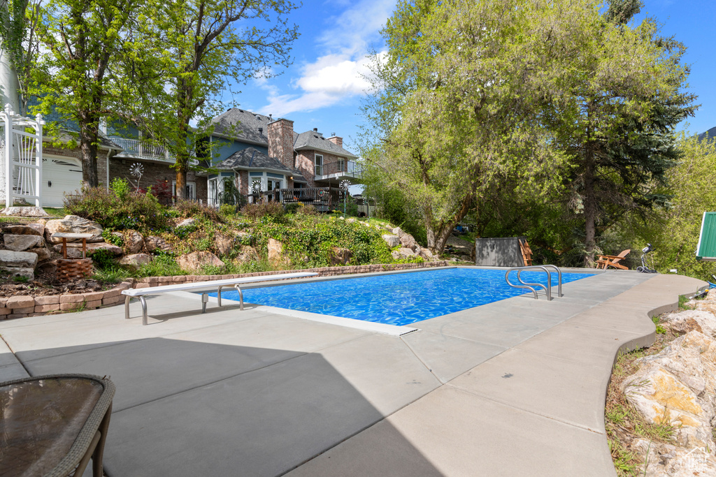 Outdoor pool featuring a patio area
