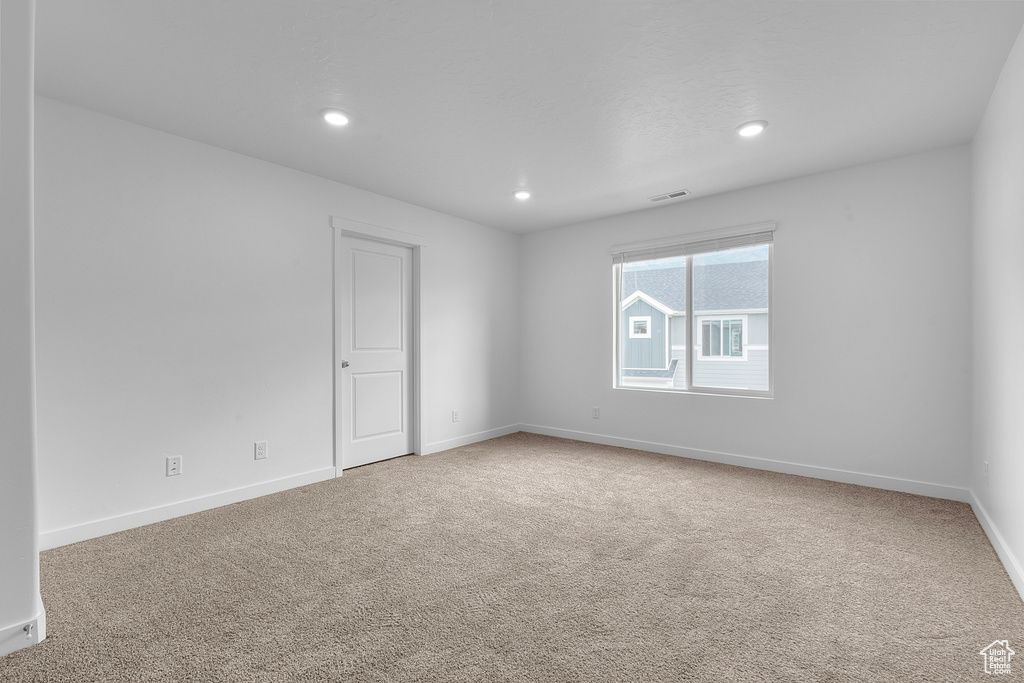 Unfurnished room with baseboards, carpet flooring, recessed lighting, and visible vents