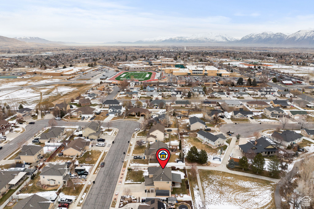 Birds eye view of property with a residential view and a mountain view