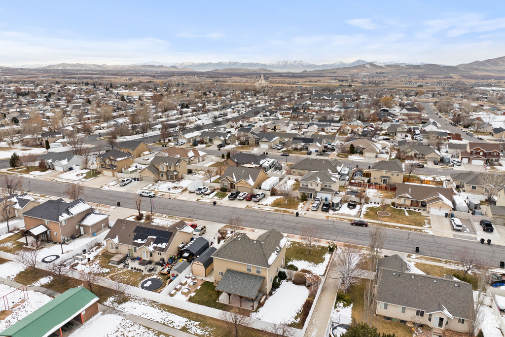 Drone / aerial view with a residential view and a mountain view
