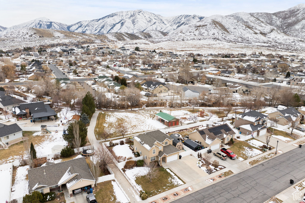Snowy aerial view with a residential view and a mountain view
