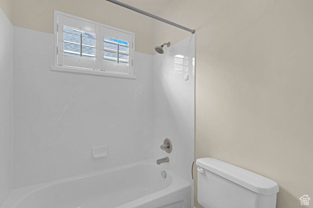 Full bathroom featuring toilet and shower / tub combination