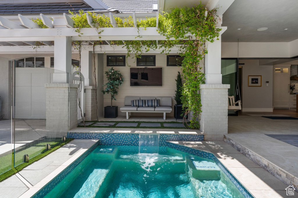 Pool featuring a patio area and a pergola