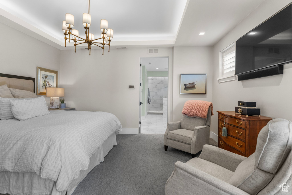Bedroom featuring baseboards, carpet floors, a notable chandelier, and visible vents