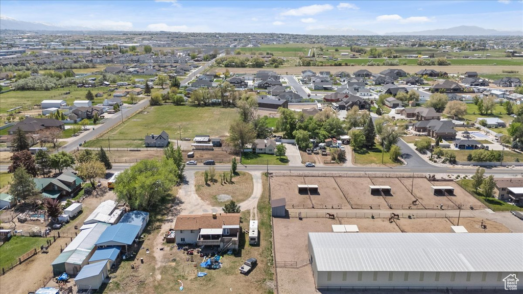 Birds eye view of property featuring a mountain view and a residential view