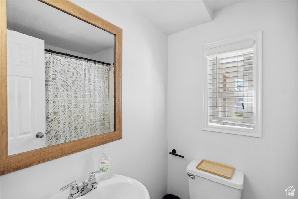 Full bath with a sink and toilet