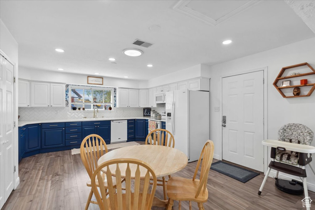 Dining room featuring visible vents, recessed lighting, and light wood finished floors