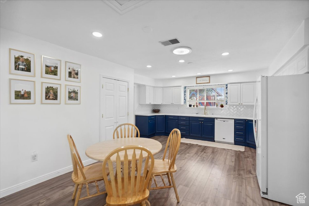 Dining space featuring baseboards, recessed lighting, wood finished floors, and visible vents