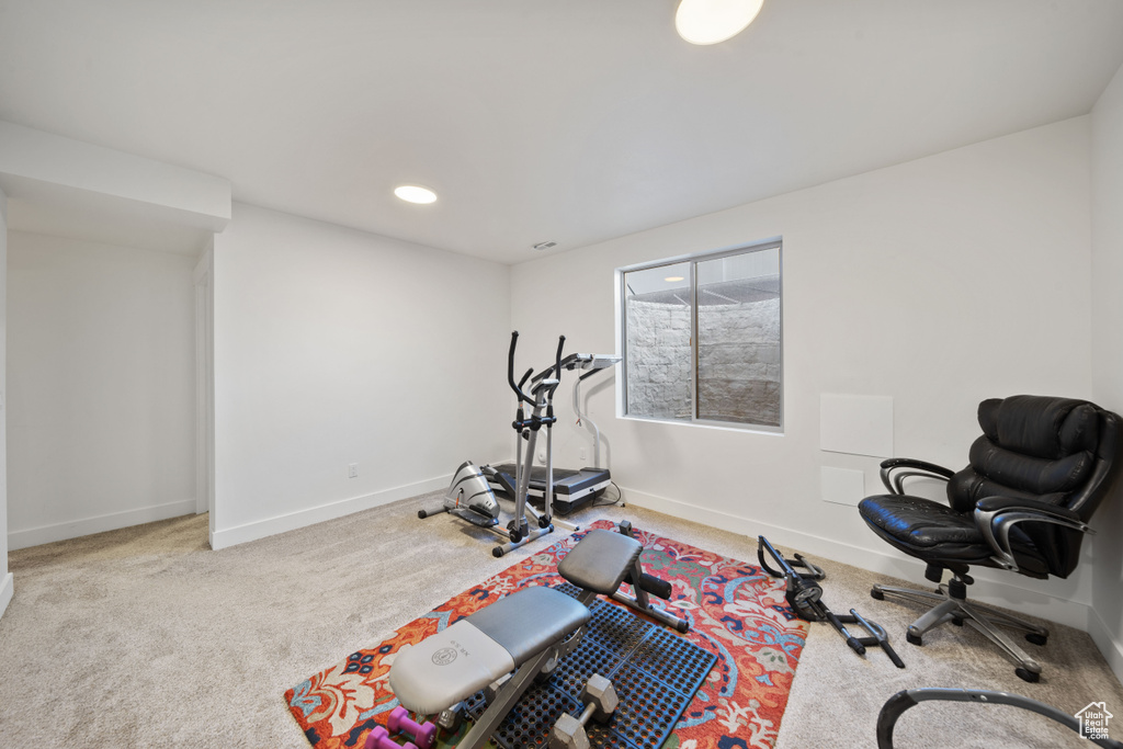 Exercise room featuring recessed lighting, baseboards, and carpet