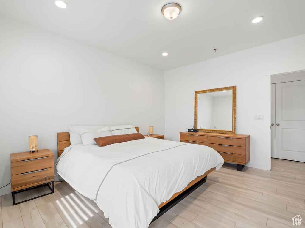 Bedroom featuring light wood-style flooring and recessed lighting