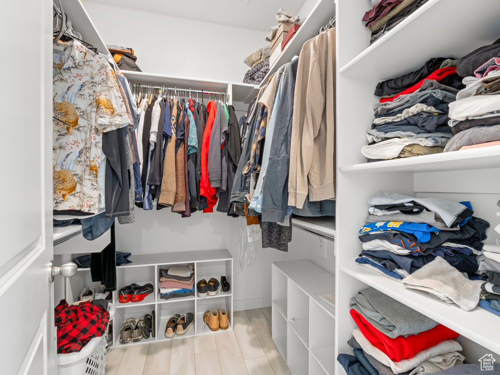 Spacious closet with wood finished floors
