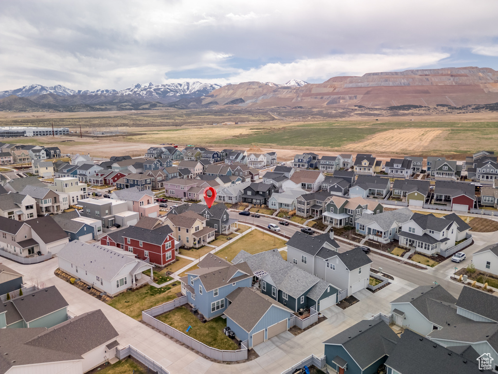 Birds eye view of property with a residential view and a mountain view