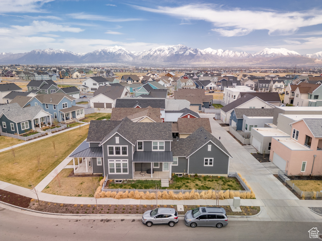 Birds eye view of property with a mountain view and a residential view
