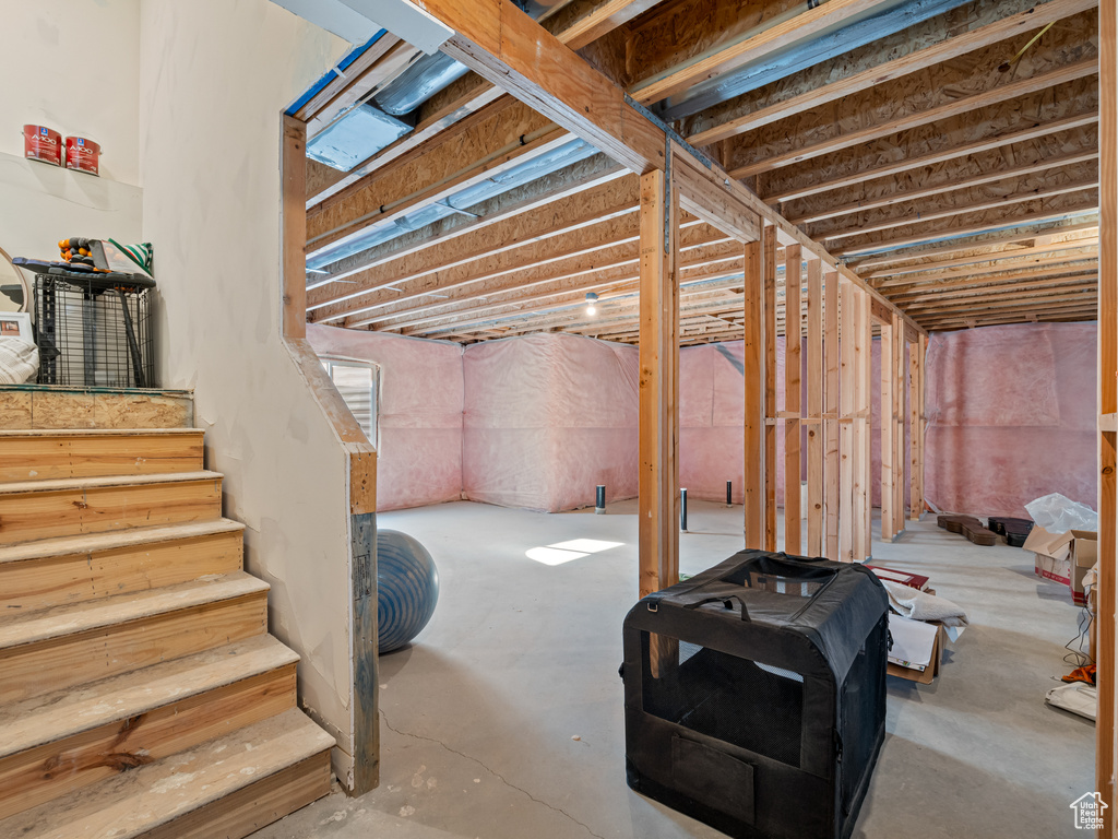 Unfinished basement with stairway