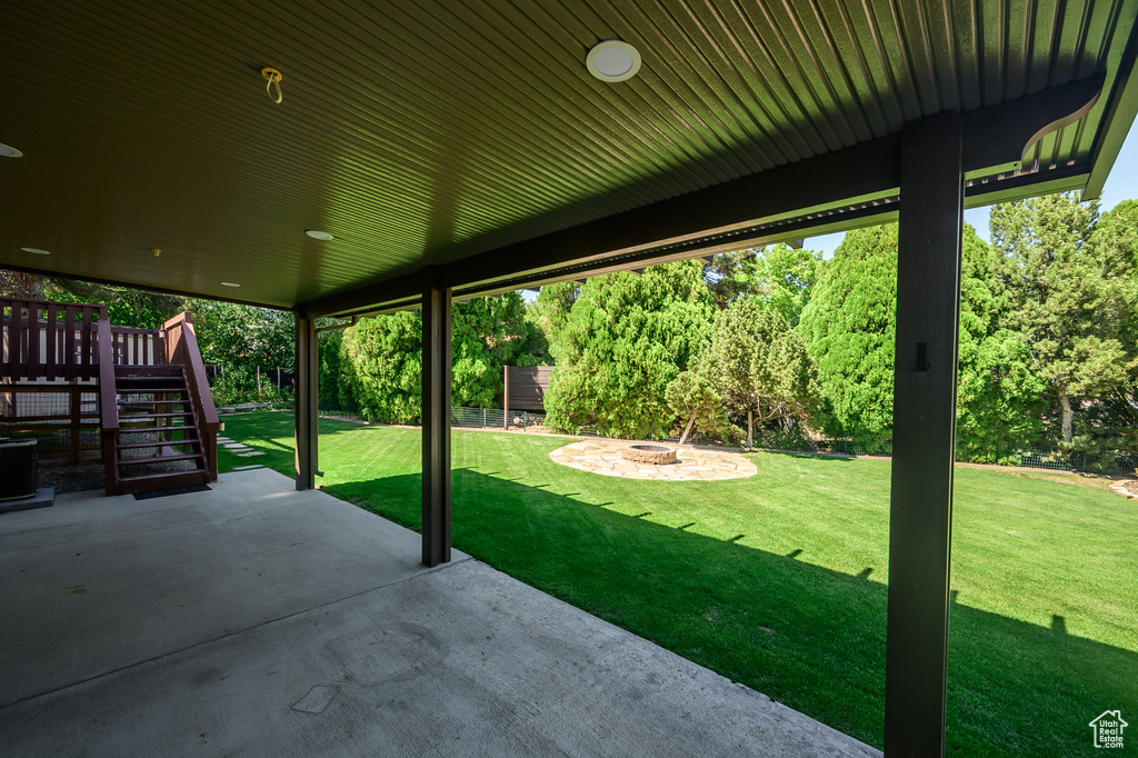 View of patio / terrace with a fire pit, stairway, and a deck