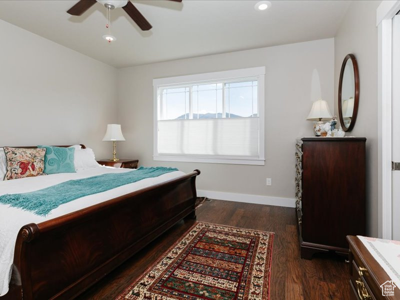 Bedroom featuring baseboards, recessed lighting, ceiling fan, and dark wood-style floors